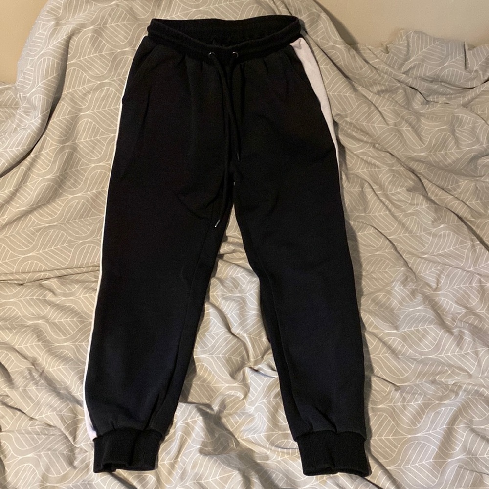 Black with white lines on the sides tracksuit.
